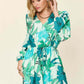 DOUBLE TAKE Full Size Floral Long Sleeve Romper with Pockets at Bella Road