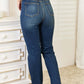 Back view of woman wearing Judy Blue elastic waistband slim bootcut jeans in blue, showcasing the comfortable and stylish fit.