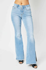 Mid Rise Raw Hem Slit Flare Jeans by Judy Blue, Full Size. Light wash, retro-inspired flare hem. Slightly stretchy, pocketed. Style #: 82601