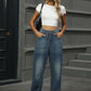 Woman wearing Half Elastic Waist Straight Leg Jeans with a white crop top and sunglasses, showcasing a comfortable and stylish denim look.