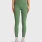 Millennia Ultra Soft High Waist Leggings in green, paired with a light blue top and stylish sneakers for a chic athleisure look.