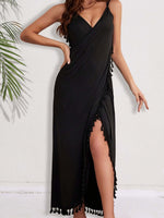 Woman wearing black backless tassel surplice spaghetti strap cover-up dress with side slit