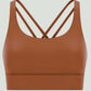 Millennia Crisscross Scoop Neck Active Tank in warm brown, showcasing stylish crisscross design for workouts.