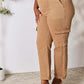 Side view of Risen Jeans' high waist straight jeans with pockets in tan, featuring a stylish and practical fit.