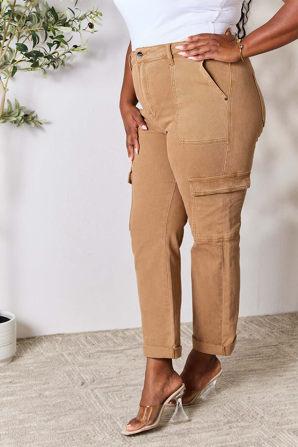 Side view of Risen Jeans' high waist straight jeans with pockets in tan, featuring a stylish and practical fit.