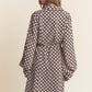 Woman wearing J.NNA geometric balloon long sleeve midi dress with waist tie, rear view showcasing trendy silhouette.