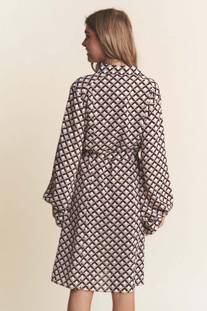 Woman wearing J.NNA geometric balloon long sleeve midi dress with waist tie, rear view showcasing trendy silhouette.