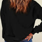 Woman wearing Bella Road SPOOKY Round Neck Long Sleeve Sweatshirt, showcasing back style with cozy fit and trendy look.