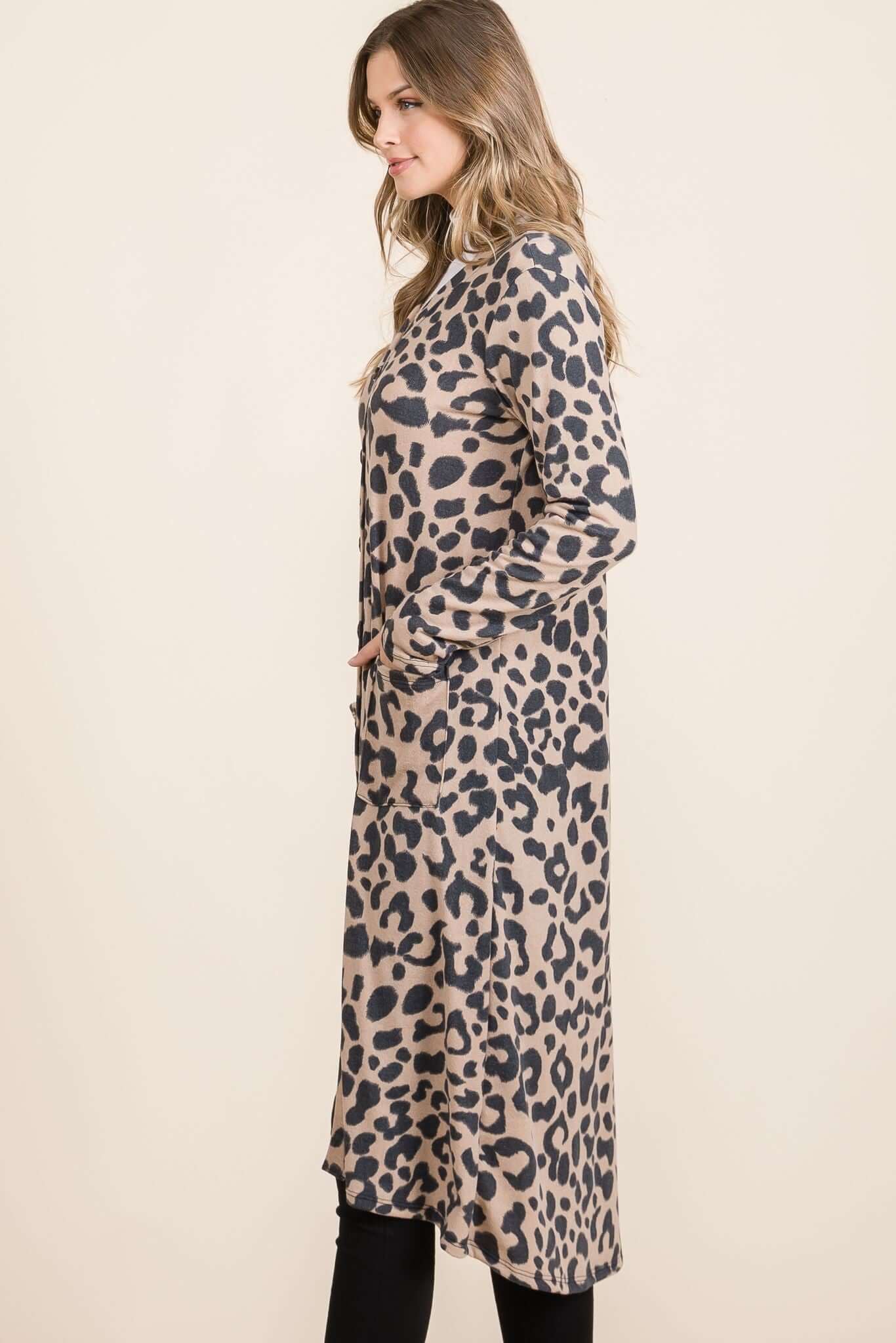 Full-size leopard V-neck long sleeve cardigan, stylishly worn with a flattering silhouette and cozy design.