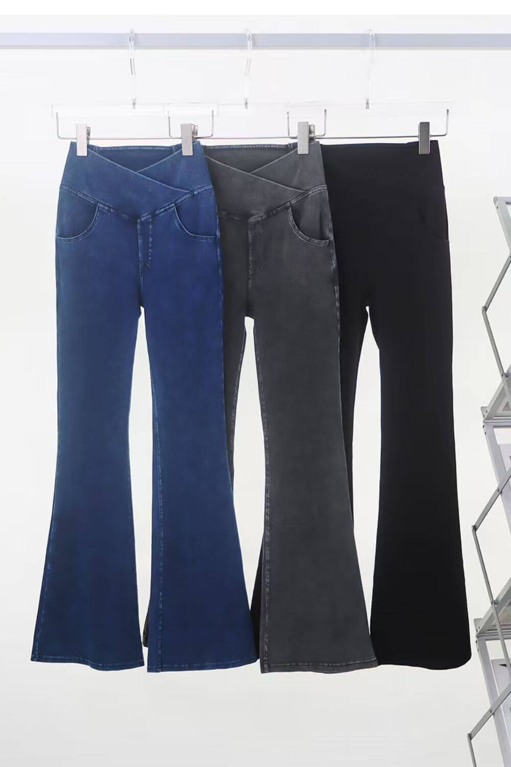 Three pairs of Basic Bae bootcut jeans in blue, gray, and black, showcasing pocketed highly stretchy denim styles.