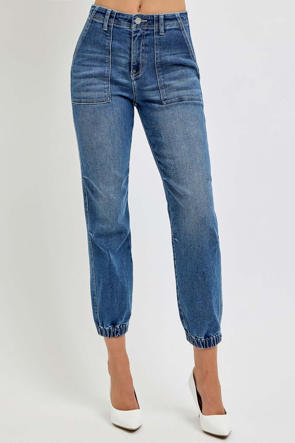 Full size high rise ankle jogger jeans with elastic cuffs, showcasing a sleek silhouette and comfort in blue stretchy denim.