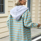 Woman wearing Bella Road Drawstring Plaid Long Sleeve Hooded Jacket with blue and beige pattern