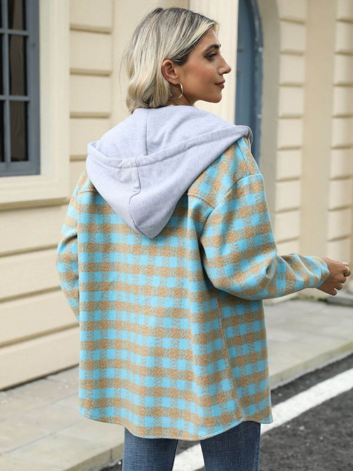 Woman wearing Bella Road Drawstring Plaid Long Sleeve Hooded Jacket with blue and beige pattern