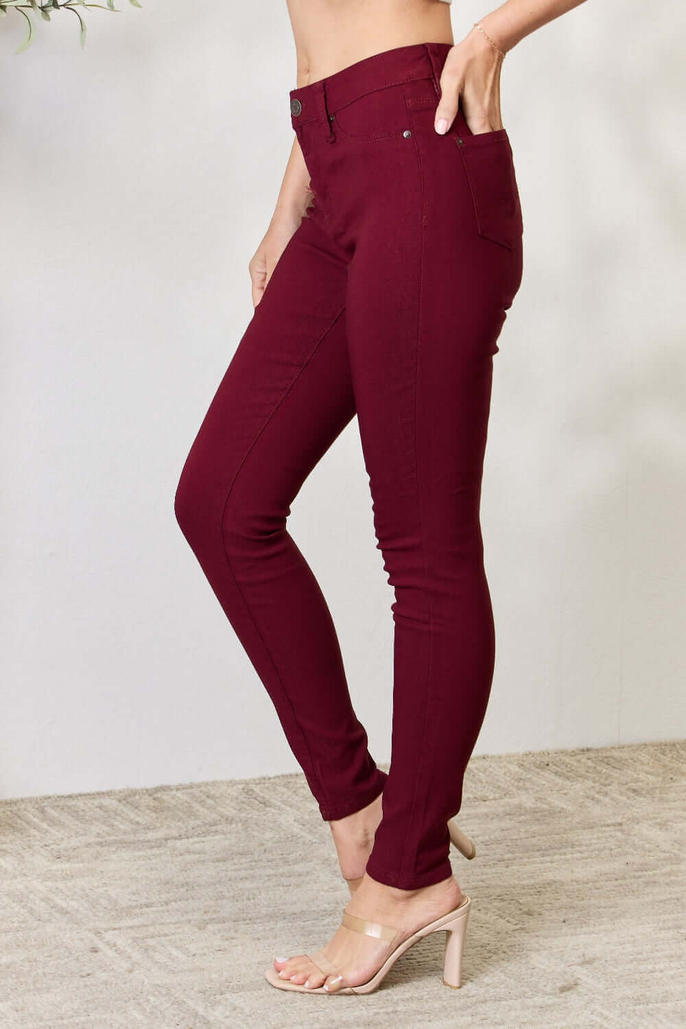 Flex in style with YMI Hyperstretch Mid-Rise Skinny Jeans in burgundy, perfect for both office and home comfort.