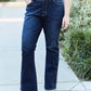 Woman wearing slim bootcut jeans with modern style and classic comfort. Perfect fit with bootcut leg for a touch of flair.