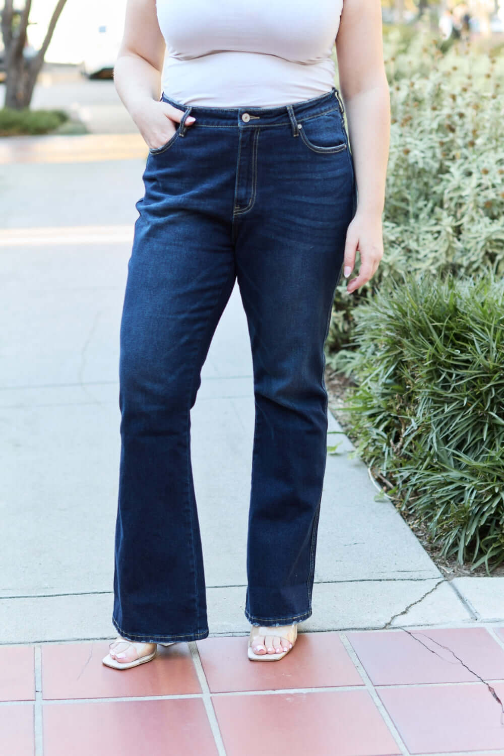 Woman wearing slim bootcut jeans with modern style and classic comfort. Perfect fit with bootcut leg for a touch of flair.