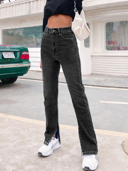 Woman wearing Bella Road Side Slit High Waist Jeans with Pockets in black, standing outdoors with a green car in the background