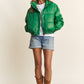 Stylish green J.NNA faux leather turtleneck crop puff jacket with zipper and snap closure, perfect for fall weather.