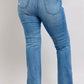 Back view of Judy Blue high waist tummy control vintage wash slim bootcut jeans with side slit detail.