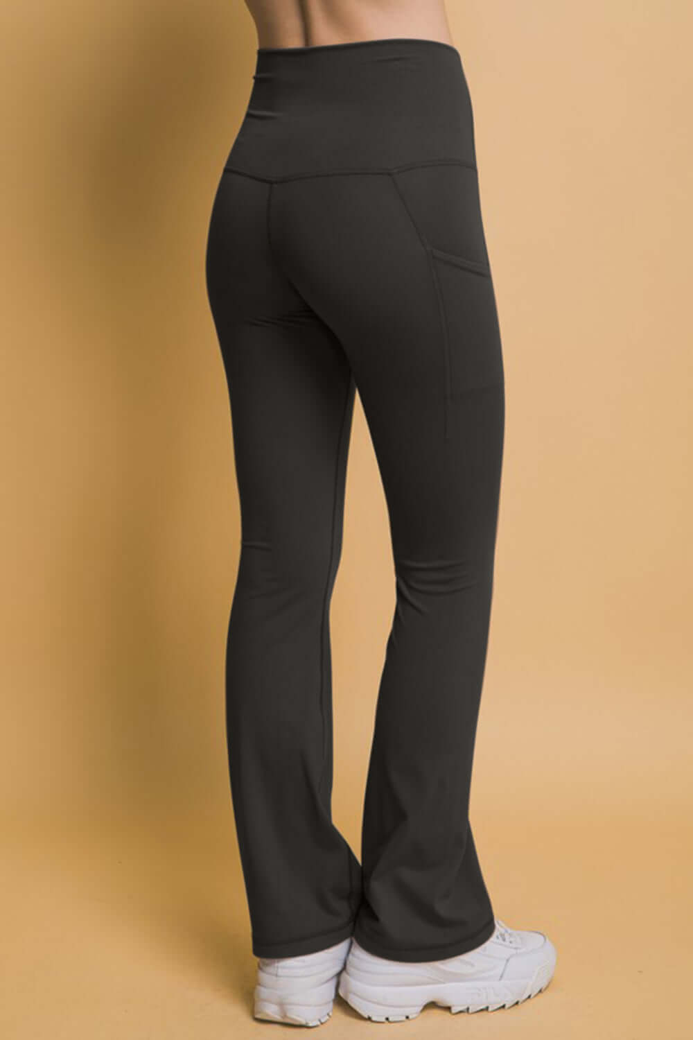 Back view of Love Tree High Waist Flare Leggings with pockets, perfect for workout or casual wear.