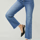 High Waist Raw Hem Slit Straight Jeans by Risen Jeans with a flattering fit, edgy details, and versatile style.