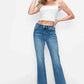 Woman wearing bytos Cat's Whiskers mid-rise bootcut jeans with a cropped white top, showcasing a stylish and playful look.