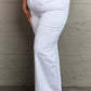 Raelene High Waist White Wide Leg Jeans - Risen Jeans elevating fashion with a flattering fit accentuating curves and retro flair