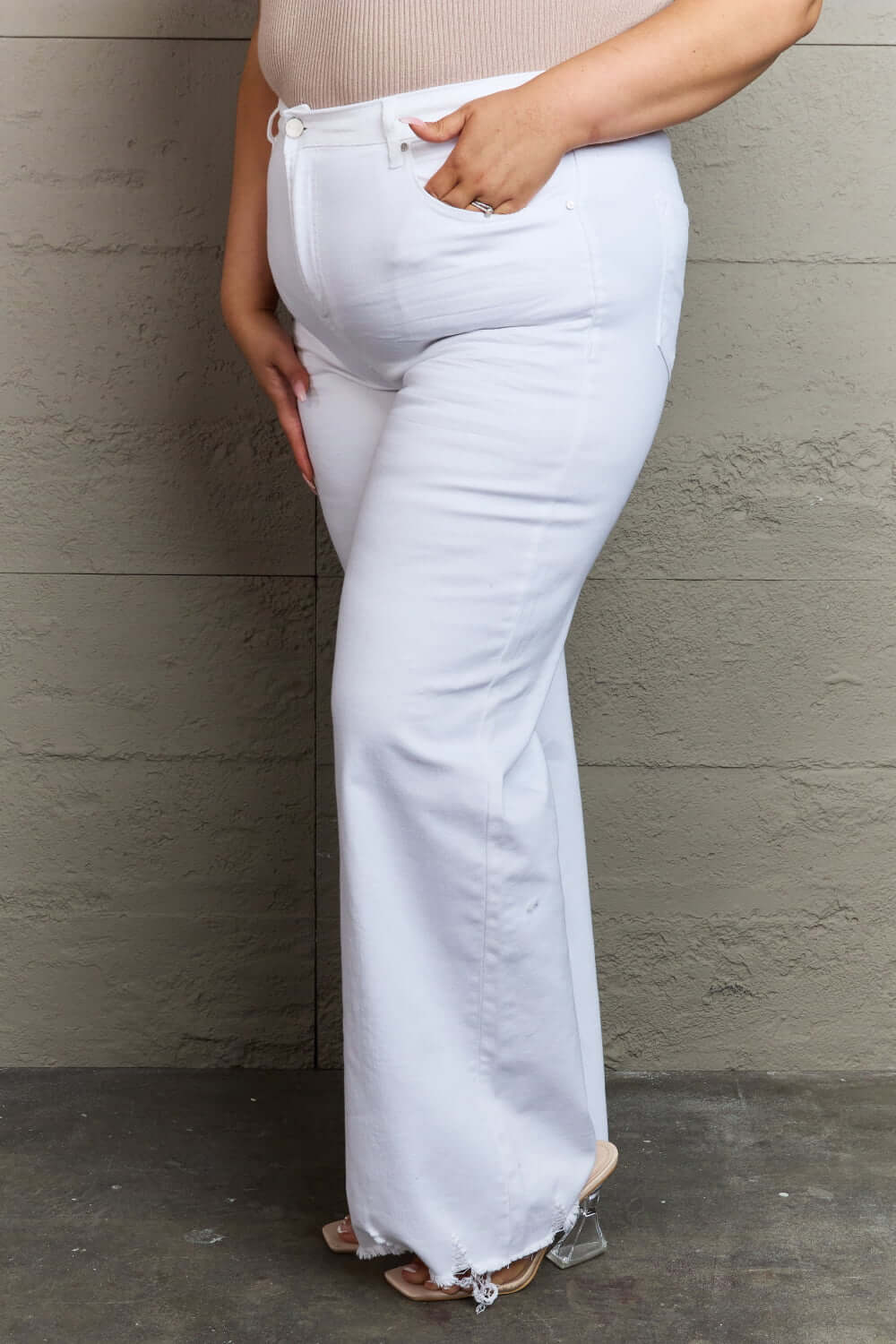 Raelene High Waist White Wide Leg Jeans - Risen Jeans elevating fashion with a flattering fit accentuating curves and retro flair