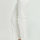 High Rise Tummy Control Straight Risen Jeans in white with raw hem, providing a flattering fit and edgy charm, modeled with black heels