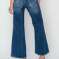 High rise patch detailed wide leg crop jeans, back view showcasing denim design and patch details, perfect for making a fashion statement. Risen Jeans.