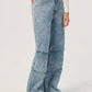 Model showcasing Bella Road Denim Wide Leg Jeans with pockets in light wash, perfect for casual fashion.