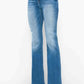 Distressed high rise jeans in blue with pockets, offering vintage charm and modern style for a flattering fit.