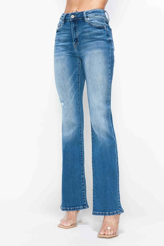 Distressed high rise jeans in blue with pockets, offering vintage charm and modern style for a flattering fit.