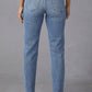 Back view of Distressed Raw Hem Straight Jeans with Pockets in blue denim worn by a model