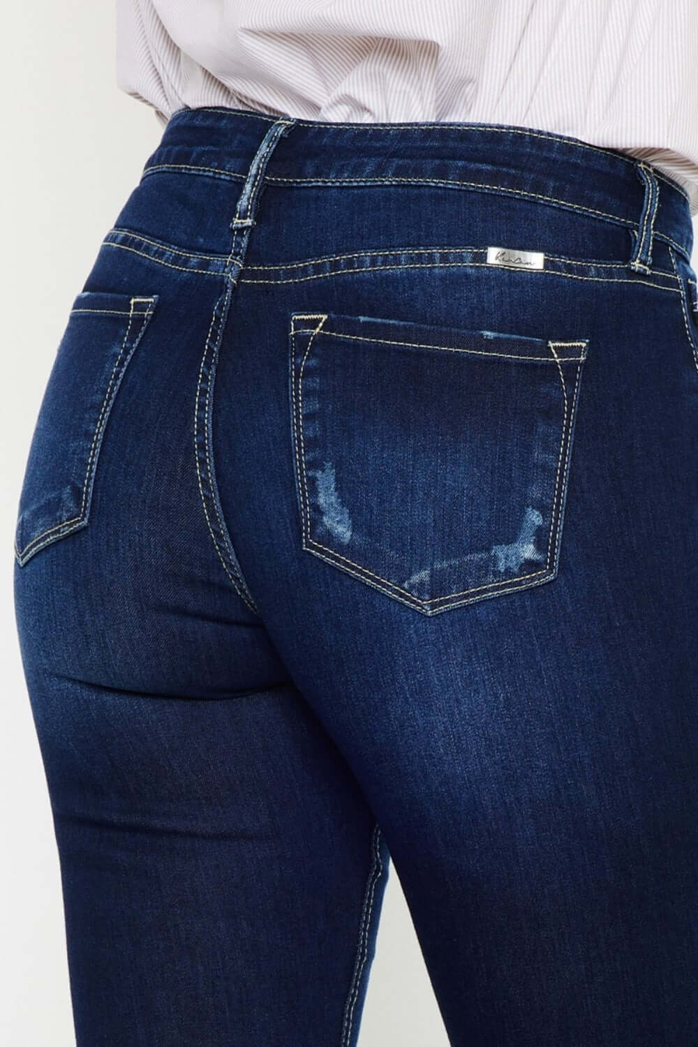 Mid-rise slim flare jeans in dark stonewash, showcasing back pocket detail and stretchy denim for a flattering fit.