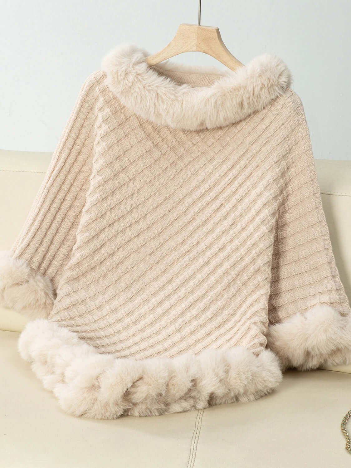 Cozy Bella Road Fuzzy Trim Poncho in soft beige with textured stripes and fluffy trim, perfect for chilly days.