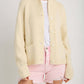 Woman wearing Bella Road Lobster Button Up Long Sleeve Cardigan in cream, perfect for a stylish and cozy look.