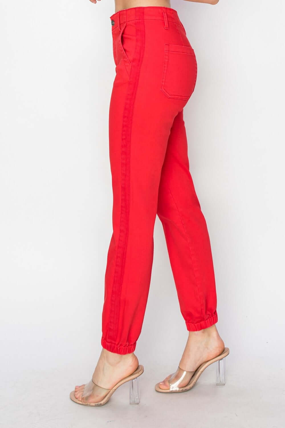 Risen full size high waisted red jogger jeans with relaxed fit, featuring stretch fabric and flattering high-rise waistline.