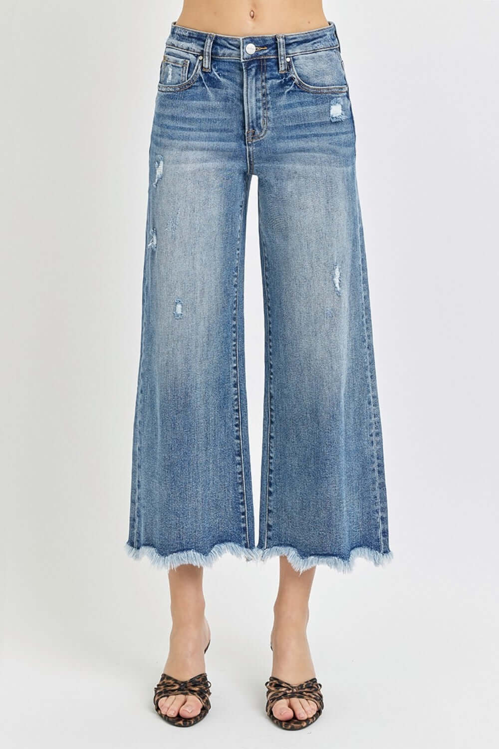 High Rise Cropped Flare Jeans by Risen Jeans, featuring distressed details and raw hem, perfect for a modern and chic look.