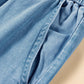 Close-up of light wash denim with drawstring waist and spacious cargo pocket detail. Perfect blend of comfort and style!