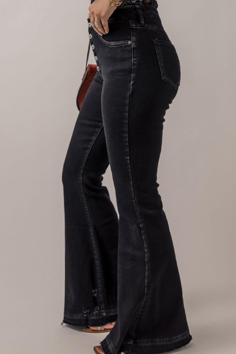 Bella Road Button-Fly Flare Jeans with Pockets in black, side view showcasing pocketed design and button details