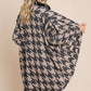 Stylish woman wearing a BOMBOM houndstooth open front cocoon knit cardigan with a chic and cozy design, perfect for layering.