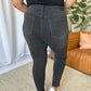 Back view of model wearing RFM Full Size High Rise Tummy Control Skinny Jeans in dark wash