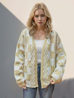 Woman wearing Double Take Checkered Cardigan in tan, featuring open front and dropped shoulders for a playful, stylish look.