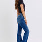 Model showcasing Judy Blue mid-rise bootcut jeans with thermal lining, highlighting the classic silhouette and comfortable fit.