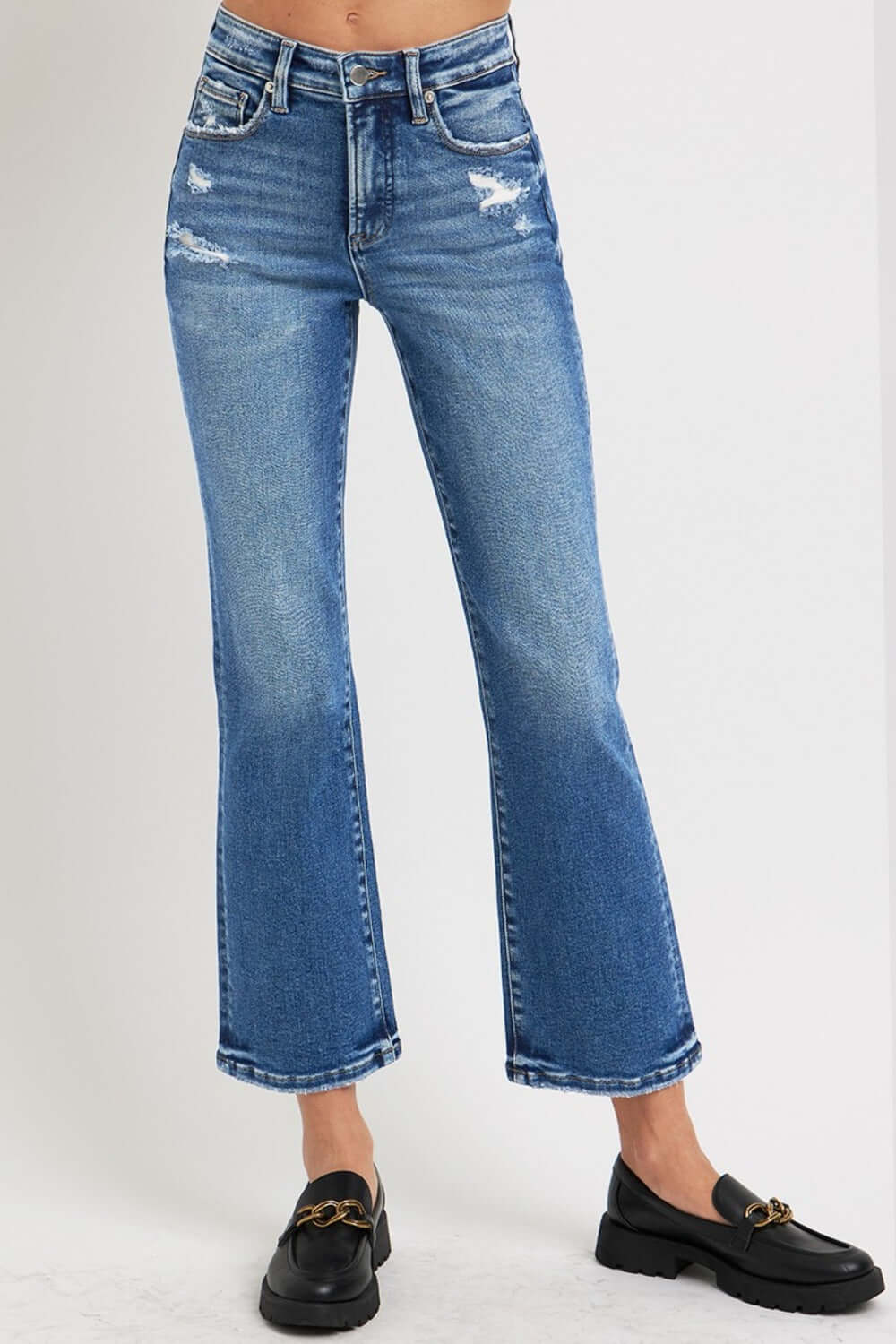 RISEN Full Size Tummy Control High Rise Crop Bootcut Jeans with a distress finish, featuring a flattering silhouette and slight stretch.