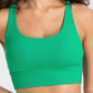 Millennia Crisscross Scoop Neck Active Tank in vibrant green, showcasing stylish design and comfort for workouts.