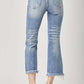 High Waist Distressed Cropped Bootcut Jeans in blue denim, showcasing back view with edgy details and modern cropped hem. Risen Jeans style.