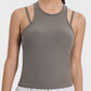 Millennia Cutout Racerback Active Tank in taupe, showcasing a stylish and breathable design perfect for workouts.