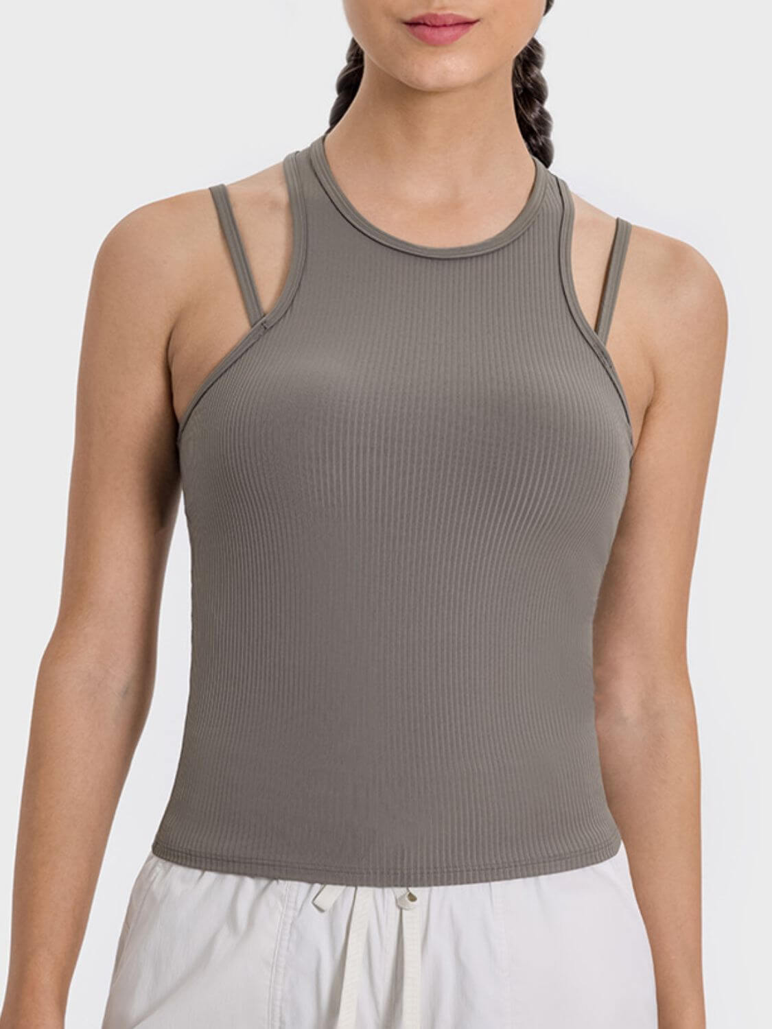 Millennia Cutout Racerback Active Tank in taupe, showcasing a stylish and breathable design perfect for workouts.